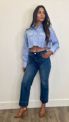 Elevate your wardrobe with our trendy cropped button-up shirt! Featuring a classic collared neckline and button closure, this shirt exudes sophistication. The front pockets add both style and functionality, while the cropped length adds a modern touch. Perfect for pairing with high-waisted bottoms, it's a must-have for any fashion-forward individual.