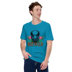 a man wearing a blue buffalo t - shirt with the word buffalo printed on it