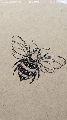 a drawing of a bee on a piece of paper