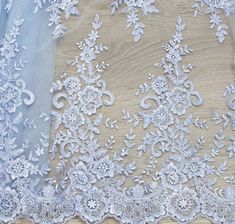 Blue Guipure - Floral fabric - Wedding guipure - Lace embroidery fabric flowers - blue guipure lace fabric - Wedding Fabric Unique guipure lace fabric Price for length 1 meter = 39.4 in = 59$ Color: Ivory, Mint, Pink, Black, White Width: 53 in = 1,35 m Material: 100% Nylon / 100% Polyester So, if you buy 1 meter (39,4 in) you take piece 1 m * 1,35 m. We cut the required length into one piece. Please, pay attention to the photos. Notes: limited quantity. *Shipping company: Ukrpochta, DHL Express Blue Lace With Lace Trim For Wedding, Blue Lace For Wedding, Blue Embroidered Lace Fabric For Wedding, Blue Embroidered Wedding Fabric With Lace Work, Blue Embroidered Fabric With Lace Work For Wedding, Blue Embroidered Lace Work Fabric For Wedding, Blue Tulle Fabric For Wedding, Blue Lace Patchwork For Wedding, Peach Lace