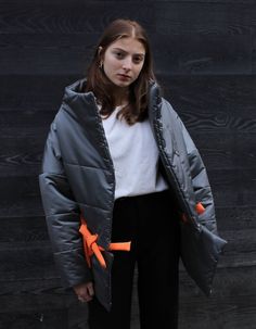 The jacket can be transformed into a shorter version. The lower part is detachable.The model is wearing M oversize.She is 175 cm/ 50 kg / bust 81 / waist 59 / hips 87.Fabric – Water ResistantStuffing – SinteponLining – Satin 40%; polyester 60%.Weights up to 2.5 kgCare: Wash at 30°c, manual washing mode.Measurements:XS - Bust(cm):80-82; Waist(cm):63-64; Hips(cm):87-89.S - Bust(cm):83-84; Waist(cm):65-66; Hips(cm):90-92.M - Bust(cm):88-90; Waist(cm):68-70; Hips(cm):94-96.L - Bust(cm):92-94; Waist( Puffer Jacket, The Model, Georgia, Puffer, Bomber Jacket, Satin, Grey, Water, How To Wear