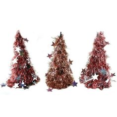 three red tinsel christmas trees with stars on them