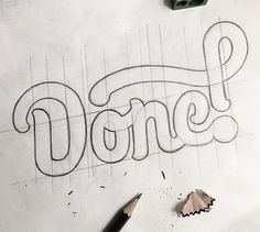 a pencil drawing the word donee on paper with crayons next to it