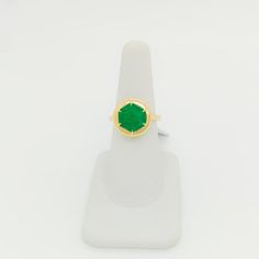 Beautiful 3.94 ct. emerald hexagon in a handmade 18k yellow gold mounting.  Ring size 6.25.  Metal: Yellow Gold Stone: Emerald Stone Cut: Emerald Cut  Dimensions reference the ring size and are not specific to the ring itself. Exact ring dimensions are not provided. Please reach in the seller Q&A for questions. Luxury Green Octagon Rings, Green Emerald Ring With Faceted Emerald Cut, Faceted Green Emerald Cut Emerald Ring, Green Faceted Emerald-cut Emerald Ring, Green Octagon Ring With Prong Setting, Green Octagon Emerald Ring With Bezel Setting, Octagon Green Emerald Ring, Octagonal Green Emerald Ring, Formal Green Faceted Emerald Ring