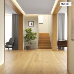 an empty living room with stairs leading up to the second floor and a potted plant