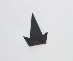 an origami bird on a white background