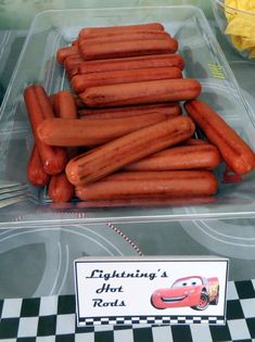 there are many hot dogs in the plastic container