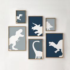 four framed dinosaur silhouettes are mounted on the wall