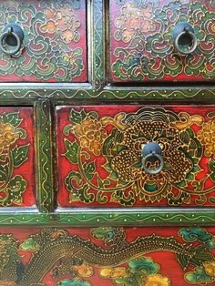 the drawers are decorated with intricate designs