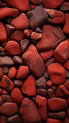 red rocks are stacked together on top of each other to create a textured background