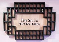 a wooden sign that says the silk's adventures on it, mounted to a wall