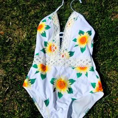 One Piece Daisy Print Swimsuit By Shein. Open Eyelet Detail Around Waist. Low Cut Front, Medium Coverage Back. Neck Tie. Never Worn. Summer Halter Neck Bodysuit For Vacation, Summer Vacation Fitted Bodysuit, Summer Vacation Bodysuit, Fitted Summer Bodysuit For Vacation, Stretch Floral Print Bodysuit For Vacation, Beachy Bodysuit For Pool Spring Season, Beachy Bodysuit For Pool In Spring, Beachy Bodysuit For Spring Pool Occasions, Fitted Summer Bodysuit For Beach