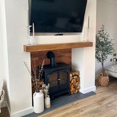 a flat screen tv mounted above a fireplace