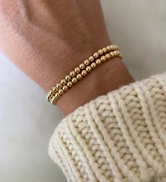 Our gold bead bracelet is essential to any bracelet stack. Made from top-quality 14k gold-filled beads on durable stretch cord. Made to last in your collection for years. 100% water-proof. Sold in a quantity of one