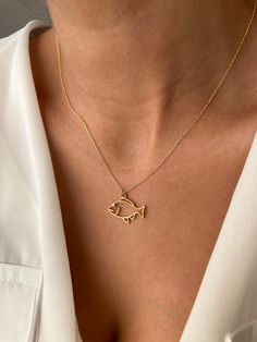 Cutest minimalist fish from the ocean Get this cute jewelry made with the high quality elements✨ You can go with 925K Sterling Silver with the options of Gold, Rose Gold or White Gold finish Beautiful jewelry for everyone 💙 Details * 925K Sterling Silver → 14K Gold, Rose Gold or White Gold plated * Chain length is approximately 18 inches (16+2 in extender) / 45 cm (40+5 cm extender) * Time is important! You will receive your package as soon as possible 🚚 * We care about the quality of metal to make sure it will last for a long time * We use enamel technique to color the jewelry and high quality zircons only * There can be tiny differences on each item, length difference of the chain as well as color changes and shade differences of the stones and enamel is possible since each jewelry pie Gold Ocean-inspired Charm Necklaces As Gift, Elegant Yellow Gold Fish Shaped Necklace, Fish Necklace Gold, Gold Fish Necklace, Sterling Silver Fish-shaped Jewelry As Gift, Elegant 14k Gold Fish-shaped Jewelry, Sterling Silver Fish-shaped Jewelry Gift, Sterling Silver Fish-shaped Jewelry, Enamel Fish-shaped Jewelry For Gifts