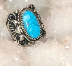 Stunning, Hand crafted Kingman Turquoise from the Kingman mine in Arizona, hand crafted by Navajo artist. Fantastic Navajo silver work! One of a kind beauty! Size 9 We also do custom ring sizing for all of our pieces. Please message us in chat on our website here and we can add sizing to this one of a kind piece. Western Style Turquoise Sterling Silver Ring, Western Sterling Silver Gemstone Ring, Western Style Sterling Silver Gemstone Ring, Southwestern Untreated Turquoise Sterling Silver Ring, Untreated Southwestern Turquoise Sterling Silver Ring, Untreated Southwestern Turquoise Ring Gift, Handmade Western Style Silver Turquoise Ring, Handmade Western Turquoise Ring In Sterling Silver, Handmade Silver Turquoise Ring In Western Style