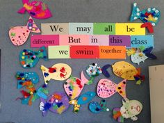 the bulletin board is covered with colorful magnets and paper cutouts that say we may all be different, but in this class we swim together