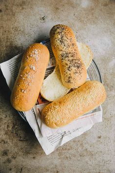 three loaves of bread sitting on top of a plate