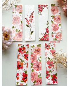 four pieces of paper with flowers painted on them