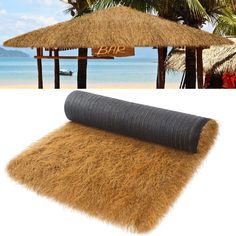 an image of a grass mat on the beach with palm trees in the back ground