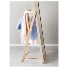 a clothes rack with a blue shirt hanging on it