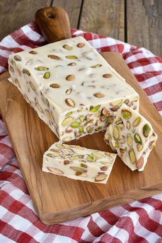 a piece of cake sitting on top of a wooden cutting board