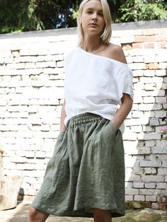 "Short linen skirt with delicate, decorative pleats on the front. Relaxed fit with mid waist. Gorgeous, elegant and natural. The simple cut, perfect for any figure. Pair with our linen tops. Midi and long versions also available. Made in our workshop for you. Authentic hand-made. DETAILS: - 100% washed, softened, light linen. - Includes one linen skirt - The images above show the eucalyptus colour - Wide waistband ensures comfort - Pockets on the sides - Short slits on the sides - Shrinkage afte Short Linen Skirt, Linen Tops, Linen Short, Linen Jacket, Skirt With Pockets, Skirt Skirt, Linen Skirt, Style Expert, Linen Top