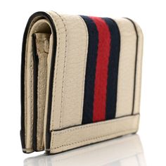 This is an authentic GUCCI Textured Calfskin Web Ophidia Card Case in Mystic White. This stylish wallet is crafted of calfskin leather in white with a blue and red stripe. This wallet features a snap button closure in gold. The card case opens to a white leather interior with card slots, a coin compartment and a bill compartment. Gucci Wallet, Red Stripe, Leather Interior, Snap Button, Card Case, White Leather, Calf Skin, Card Slots, Slots