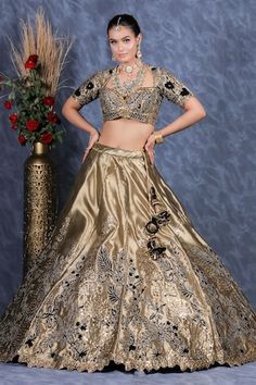 Olive green flared tissue organza kalidar lehenga with contrasting black velvet patch ambrosia embroidery and gota lace bloom highlights. Paired with a matching embroidered flattering Queen Anne neck blouse and a spluttered mukaish embellished cutwork bloom border organza dupatta. - Aza Fashions Organza Blouse Piece For Reception, Transitional Organza Blouse Piece For Reception, Transitional Organza Choli With Sheer Dupatta, Transitional Organza Lehenga With Cutdana, Organza Traditional Wear With Pallu For Reception, Reception Organza Sets With Pallu, Transitional Lehenga With Pallu In Organza, Organza Choli With Cutdana For Reception, Reception Organza Choli With Cutdana