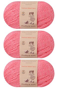 two skeins of yarn in pink, one is red and the other is light pink