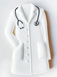 a white porcelain figurine with a stethoscope on it's chest