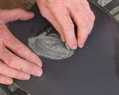 an older man is working on a skateboard with his hand and thumbnails