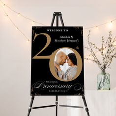 an easel with a sign that says welcome to married and matthiew johnson's 20th anniversary