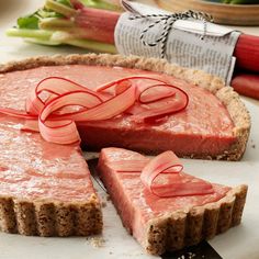 a raw meat pie with slices cut out on a cutting board