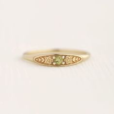 August birth ring This ring will be a very meaningful piece for those born in August . August's birthstone and birth flower are Peridot and Poppy. Greeny peridot and delicately carved poppy will shine and bloom forever. This dainty and slim signet ring is comfortable to wear all the time. This piece will be perfect gift for both to others and yourself. * Detail * Material : 14K solid gold, 18K solid gold, 925 sterling silver Color : Yellow gold, White gold or Rose gold(925 sterling silver is excluded) Stone : Natural Peridot(2.5mm) * Size * Top width : 3.7mm Shank width : 1.2mm Band depth : 2.4-0.9mm * Please check your ring size before ordering, Use this : http://www.onlineconversion.com/ring_size.htm We provide special package with some our business card, guarantee card, gift box. Please Birth Ring, Poppy Ring, Fantasy Things, Health Guru, Ring Inspo, Ring Birthstone, Pretty Jewelry, Barrel Racing, Jewelry Studio