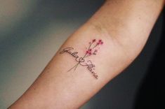 a woman's arm with a tattoo that says, faith and flowers on it