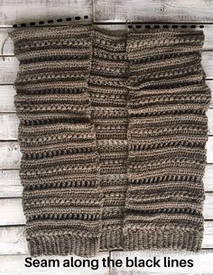 a knitted scarf hanging on a wooden wall with text that reads, seam along the black lines