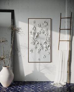 a white vase sitting on top of a blue and white floor next to a mirror