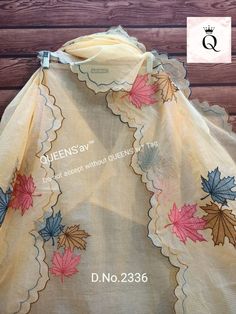 an image of the back of a dress with leaves on it and words written in english