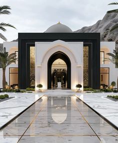 a large white and black building surrounded by palm trees