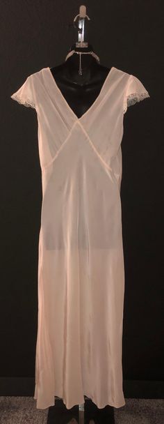 "Ultra gorgeous pink nightgown, made of rayon, has a dainty eyelet and satin stitching around the collar and arms. Made by Slender Style, bust will fit 42\", waist 36\", hips 46\", length is 56\" - lovely condition!" Cheap Pink Romantic Nightgown, Vintage Pink Slip Dress For Daywear, Pink Fitted Chemise For Wedding Night, Fitted Pink Chemise For Wedding Night, Vintage Fitted Nightgown, Pink Bias Cut Slip Dress, Vintage Pink Dress For Night Occasion, Vintage Pink Dress For Night, Vintage Pink Night Dress