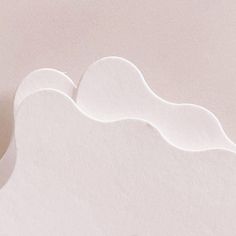 an abstract white paper background with wavy shapes