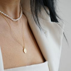 Discover the perfect blend of fun and chic with our dainty chain necklace, ideal for layering and elevating any ensemble. Crafted from recycled Sterling Silver and plated with a luxurious gold finish, each piece boasts its own unique charm. Presented in a stunning Smilla Brav jewelry box, this necklace makes for a thoughtful gift or a special treat for yourself. After each use gently wipe jewellery with a soft cloth and store it in the original Smilla Brav jewellery box or dust bag. Always prote Minimalist Gold Plated Double Chain Charm Necklace, Minimalist Gold Pearl Necklace For Layering, Gold Minimalist Pearl Necklace For Layering, Dainty Gold Plated Layered Necklace, Gold Plated Double Strand Charm Necklaces, 14k Gold-filled Pearl Charm Chain Necklace, Minimalist Gold Pearl Necklace With Paperclip Chain, Delicate Chain Layered Necklace In 14k Gold Filled, 14k Gold Filled Delicate Chain Layered Necklace