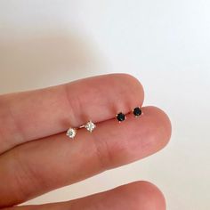 "The perfect tiny studs - these cz studs look beautiful with everything. Faceted round brilliant cubic zirconia hand-set in a high quality 4-prong setting. Understated and undeniably elegant, these are the perfect everyday stud earrings. ♦ Sold individually (1 stud) or in pairs (2 studs) ♦ Choose between Black or White cubic zirconia on the dropdown menu * D E T A I L S * ∙ Material: .925 Sterling Silver or 18K Gold Plated over .925 Sterling Silver ∙ Stone: White OR Black Zirconia ∙ Dimensions: Dainty Piercings With Diamond Accents As Gift, Dainty Piercings With Diamond Accents For Gifts, Gift Diamond Accented Round Piercings, Tiny Gold Studs, Dainty Gold Earrings, Everyday Earrings Studs, Gold Diamond Studs, Ear Jacket Earring, Minimalist Studs