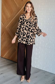 Upgrade your wardrobe with our She's Got Eyes of Gold Batwing Blouse! Made from a soft, woven material, this blouse features a trendy banded V-neckline, batwing sleeves with banded cuffs and functional buttons, and a flattering poncho silhouette. Perfect for any occasion with a touch of playfulness. Woven Banded V-Neckline Batwing Banded Sleeve Cuff Functional Sleeve Cuff Button Poncho Silhouette 100% Polyester True to Size S: Chest 72" Length 28"M: Chest 72" Length 28.5"L: Chest 74" Length 28.5 Flowy V-neck Top For Work, Oversized Versatile V-neck Blouse, Chic Flowy Blouse With Split Neck, Versatile Oversized V-neck Blouse, Brown V-neck Blouse For Day Out, Versatile V-neck Blouse For Loungewear, Chic Flowy Split Neck Blouse, Flowy V-neck Viscose Blouse, V-neck Viscose Blouse For Day Out