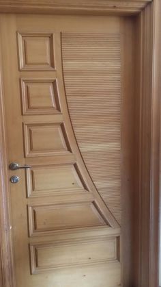 the door is made out of wood and has an interesting design