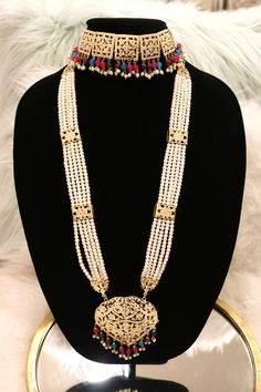 Handcrafted with love to give a real traditional look for this set beautifully studded with jadau stones and pearls give a royal look. Includes: Choker, Rani Haar, Earrings, and Tikka Diwali Kundan Pearl Necklace In Temple Style, Diwali Chandbali Pearl Necklace With Intricate Design, Elegant Kundan Bridal Sets For Eid, Diwali Temple Jewelry Kundan Pearl Necklace, Elegant Meenakari Bridal Sets For Eid, Ceremonial Temple Jewelry Pearl Necklace With Intricate Design, Elegant Hand Set Traditional Wear For Diwali, Hand Set Chandbali Pearl Necklace For Diwali, Traditional Pearl Necklace As Gift