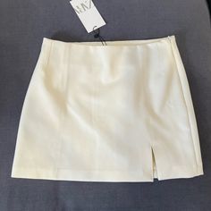 Cream Mini Skirt From Zara, Size M, Brand New Tags Still Attached. Elegant Zara Mini Skirt Lined, Elegant High-waist Beige Skort, Elegant High Waist Beige Skort, Zara High-waist Lined Skort, Zara Mini Skort With Relaxed Fit, Zara Relaxed Fit Mini Skort, Chic Zara Mini Skort, Elegant Zara Pencil Skirt For Spring, Elegant Zara Short Skirt