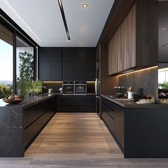 a modern kitchen with wooden floors and black cabinets