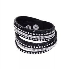 IN STOCK! Black Suede Rhinestone Studded Choker This is one of my all time favorites!  Chic and stylish suede wrap bracelet in black with rhinestones and studs.  Length is 14.5" - perfect for layering as a bracelet or wearing as a choker.  Versatile and so cool!  I wear mine all the time.  More colors on order, but this one is IN STOCK! Jewelry Bracelets Adjustable Black Crystal Bracelet With Rhinestones, Adjustable Black Crystal Rhinestone Bracelet, Black Crystal Bracelets With Rhinestones, Black Crystal Bracelet For Party, Black Crystal Party Bracelet, Leather Wristbands, Rhinestone Studs, Rhinestone Bracelet, Bracelet Bangle